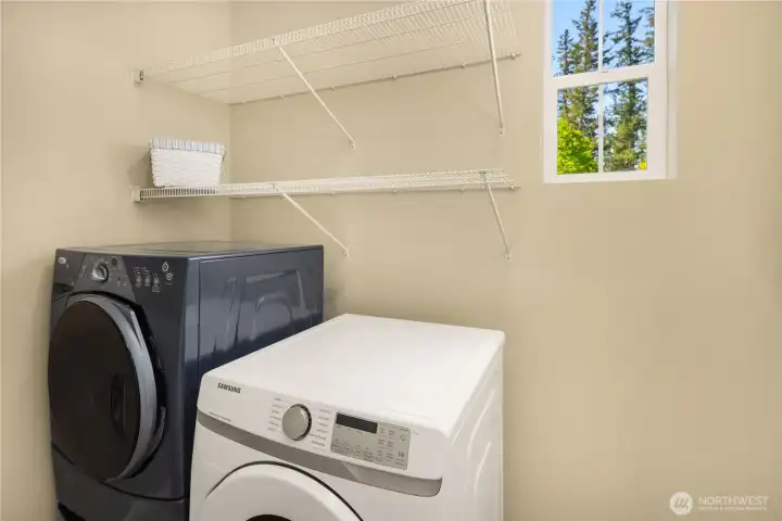 Laundry room with shelving.