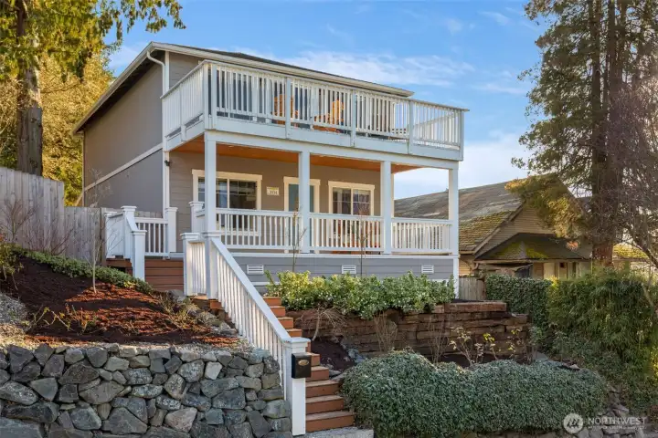 Elevated from the street, this great house has view decks from both the main entry and upstairs primary suite.