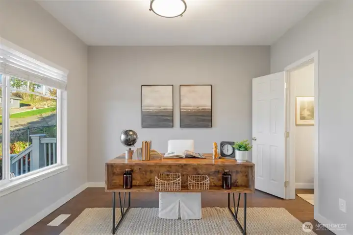 Main floor office or library room, with closet (Yes, could be a bedroom if you add a door). Door to the right is the main floor guest bath.
