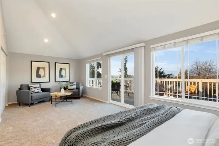 Primary suite is spacious! Plus tons of natural light and access to a big deck with views.