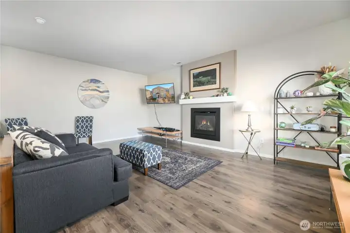 Great sized living room with gas fireplace.