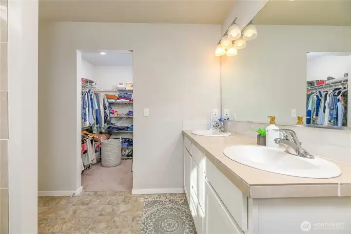 Primary bathroom with large walk-in closet.