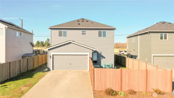 Rear view. The grassy area to the left could be extended for additional parking.