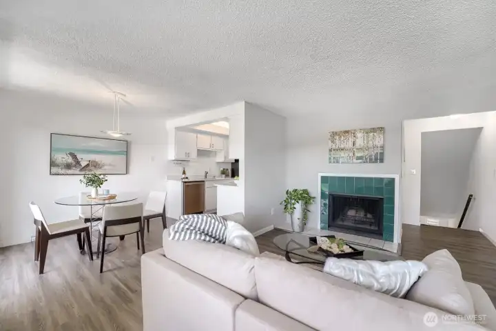 Spacious open floor plan sets the stage for entertaining, with seamless flow between living, dining and kitchen areas