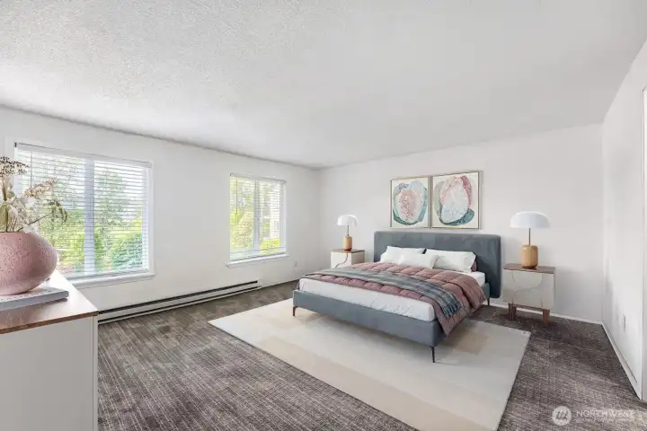 Oversized Primary bedroom (virtually staged) has ample space for a king-size bed.  Enjoy waking up to serene lake views