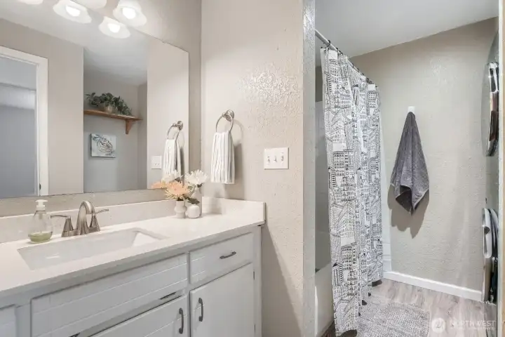 Just outside the second bedroom is a full bathroom with tub/shower