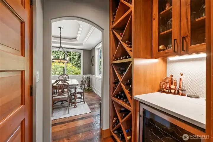 Butler's pantry with wine fridge, wine storage and walk in pantry.