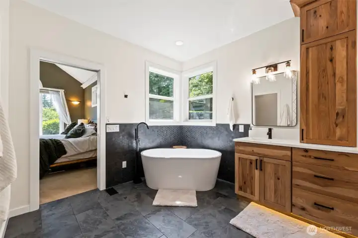 Primary bath wtih freestanding tub and tile work.