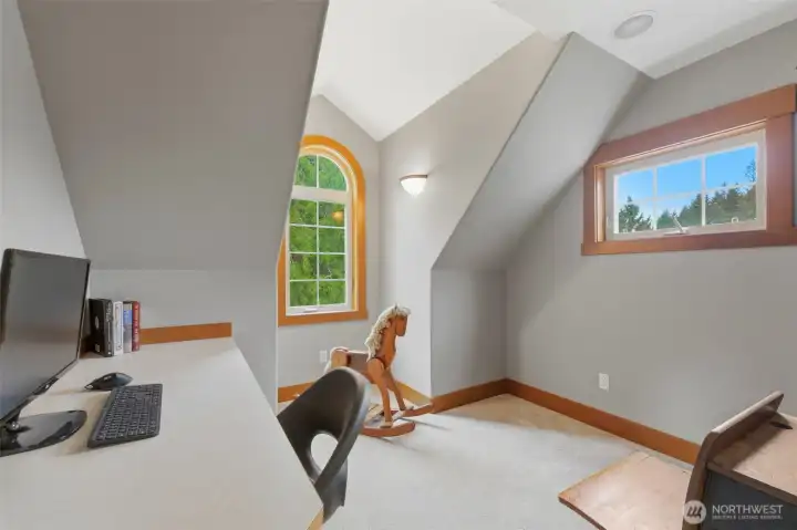 Reading nook upstairs with build in desk.