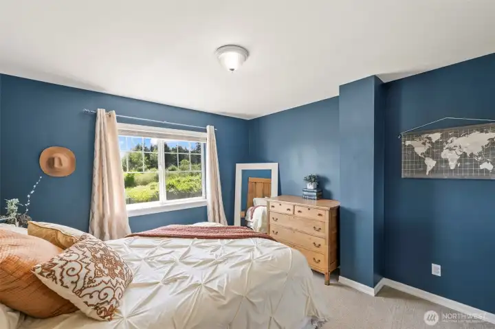 Bedroom 2 with walk in closet, built in desk/vanity and mountain view