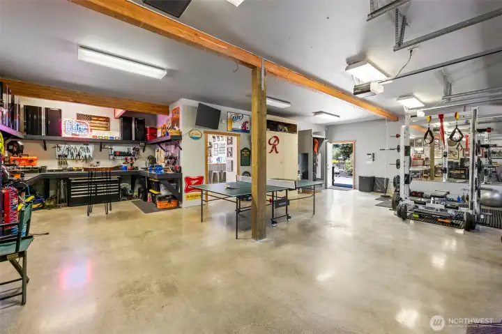 Detached garage has polished floors.