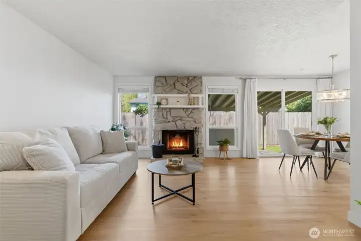 Walk into your light and bright family room with wood burning fireplace