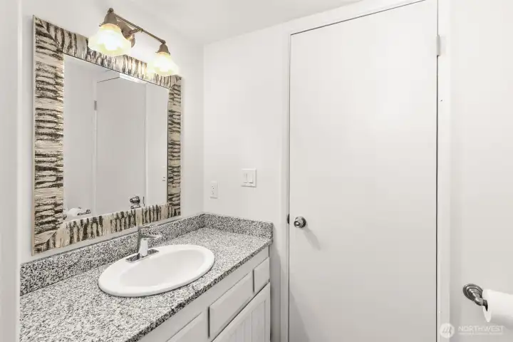 Another view of the half bathroom. This door leads to the utility room.