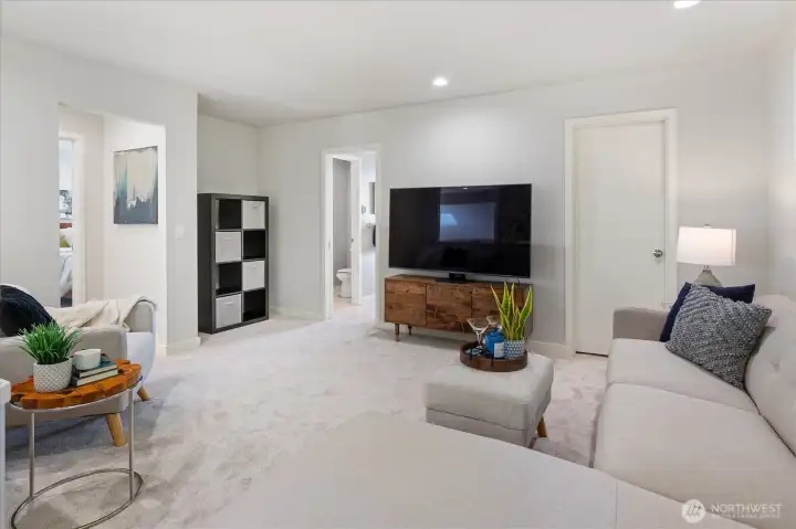 Open 3rd bedroom, staged as a bonus room to show flexible use. Easy to enclose if desired.