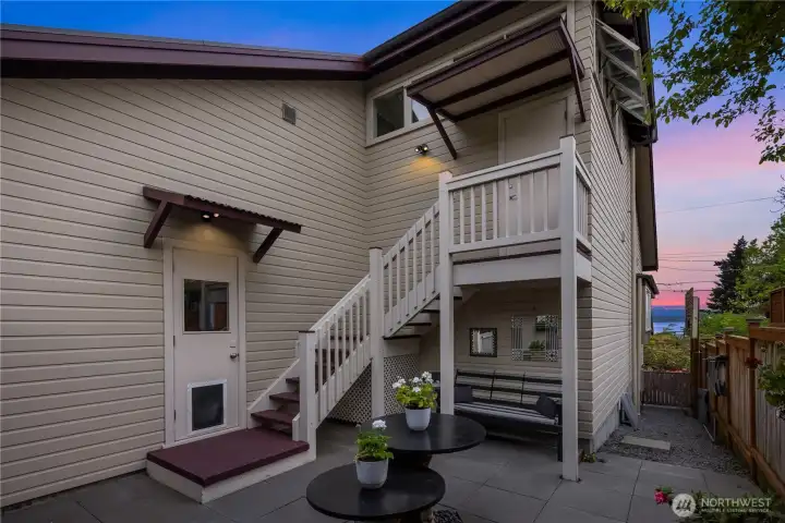 Backyard garden area and entry door to top floor suite