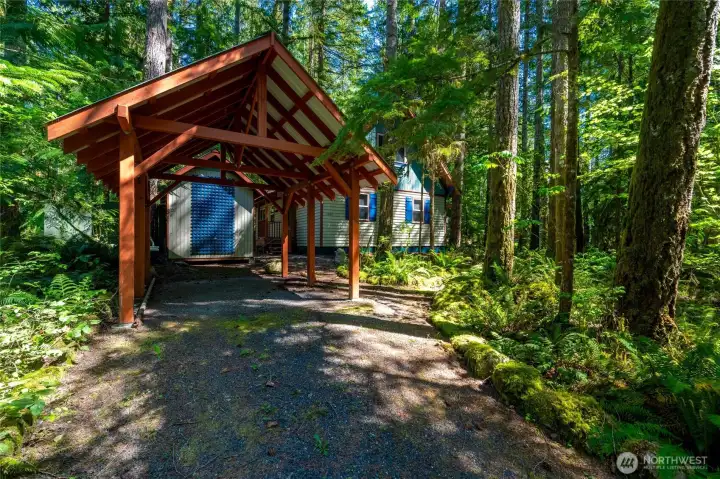 The front of the home features a covered carport, perfect for snowy winters.