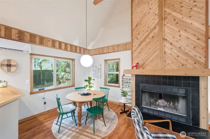 A good size dining area next to the wood burning fireplace.