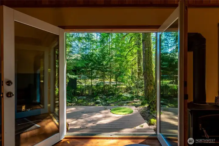 French doors open wide to enjoy the beautiful surroundings.