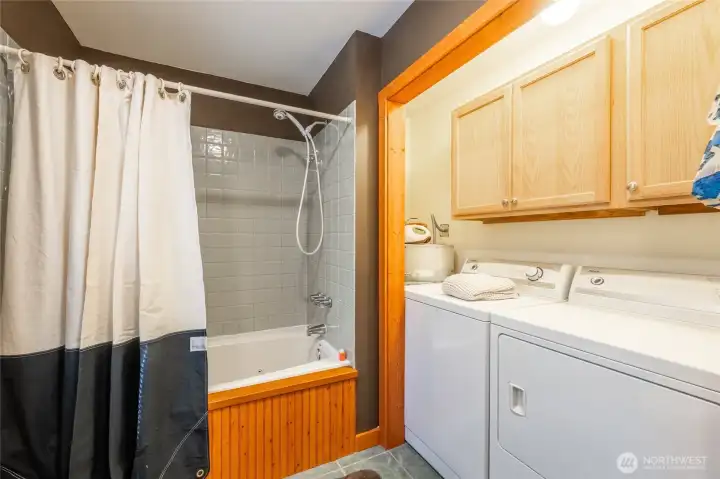 The washer and dryer are conveniently located in the main floor bathroom.