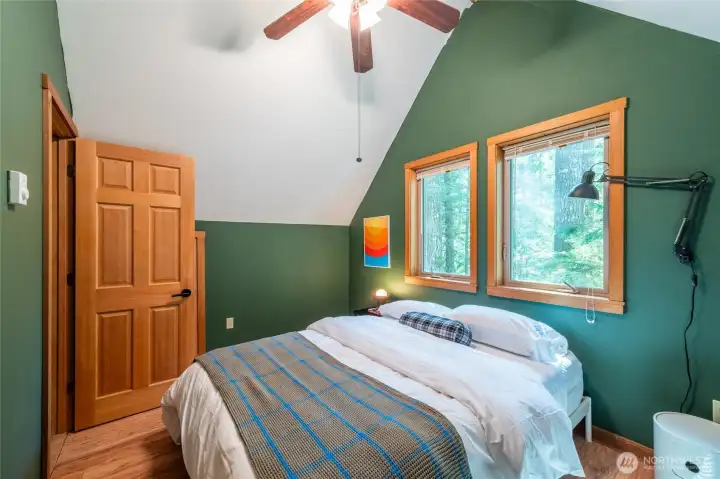 The upper bedroom is cozy and private.