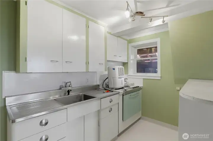 basement small kitchen adjoins extra bonus space , bedroom and bathroom