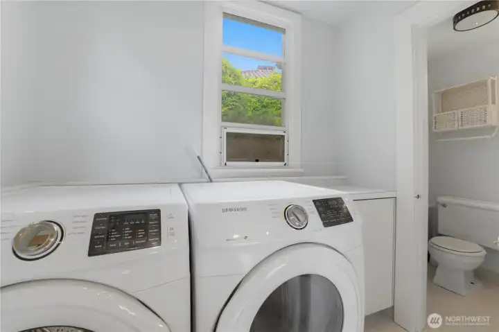 Main floor utility room with half bathroom