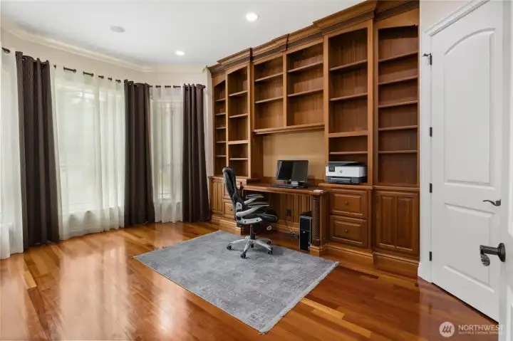 Grand Office/Den with floor to ceiling built in cabinets!