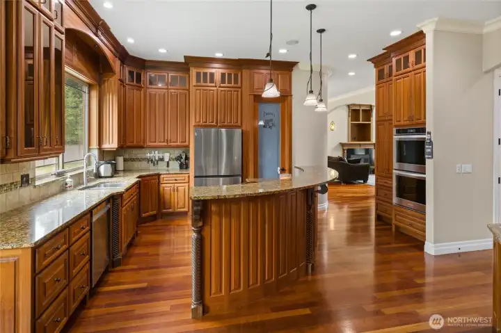 Grand Kitchen with Eating Island/Bar area.  Floor to ceiling cabinets, and pantry!