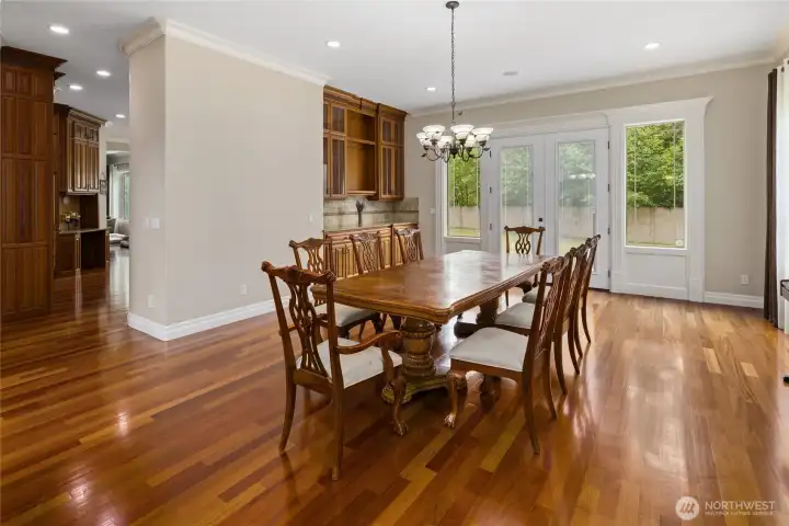Dining room with more built in cabinetry and french doors to back patio!