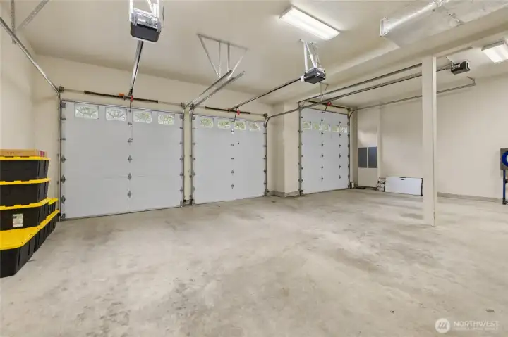 Inside Garage of home. Fits 3 cars, left side garage door higher for big trucks or equipment!  Tankless hot water