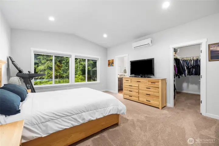 Retreat to the primary suite, where vaulted ceilings create a bright and relaxing atmosphere Retreat to the primary suite, where vaulted ceilings create a bright and relaxing atmosphere