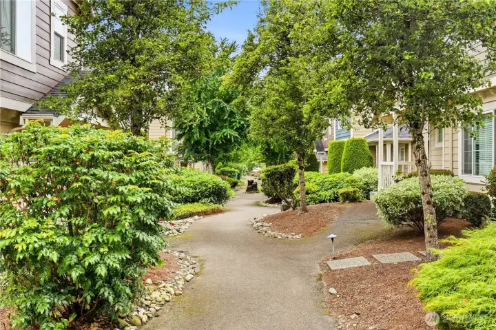 Beautifully landscaped community walkway Beautifully landscaped community walkway