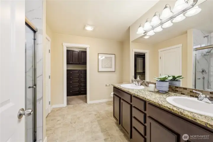 Primary bathroom with walk-in closet Primary bathroom with walk-in closet