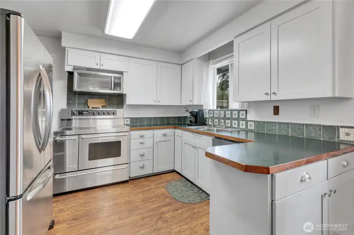 Whether you're meal prepping or hosting friends, this kitchen keeps everyone connected. Whether you're meal prepping or hosting friends, this kitchen keeps everyone connected.