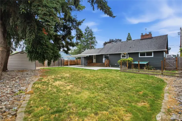 A fully fenced backyard ready for play, pets, and gatherings. A fully fenced backyard ready for play, pets, and gatherings.
