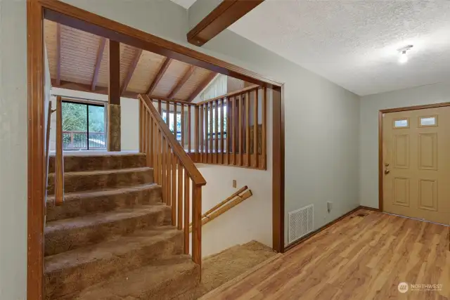 Entry Main Floor - with stairs to upper level Family Room