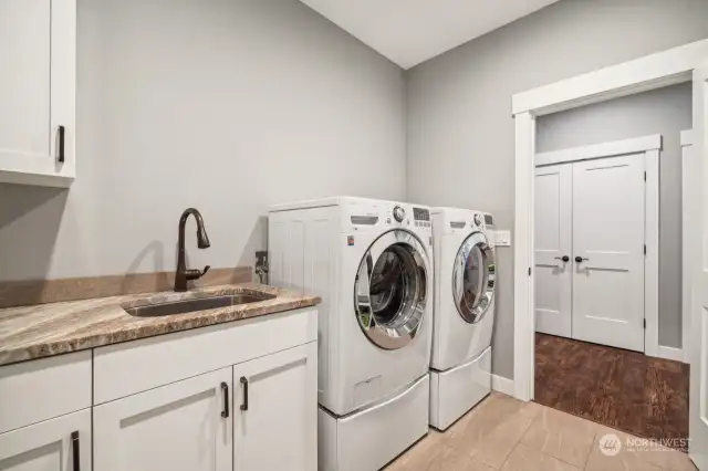 Laundry room with view of the sink