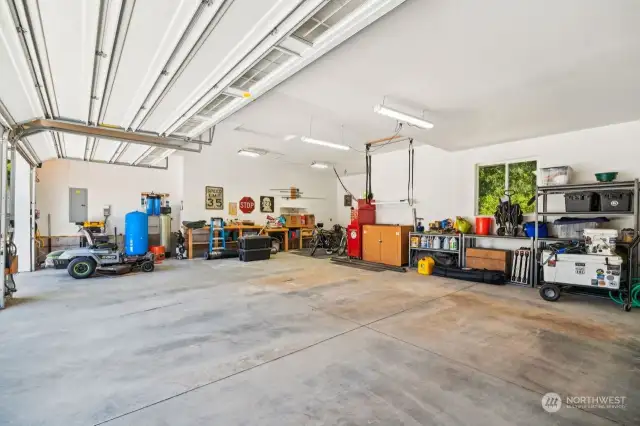 3 car garage with 2 charging stations