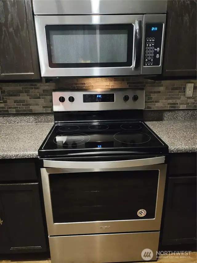 stainless Whirlpool stove and micro hood vent