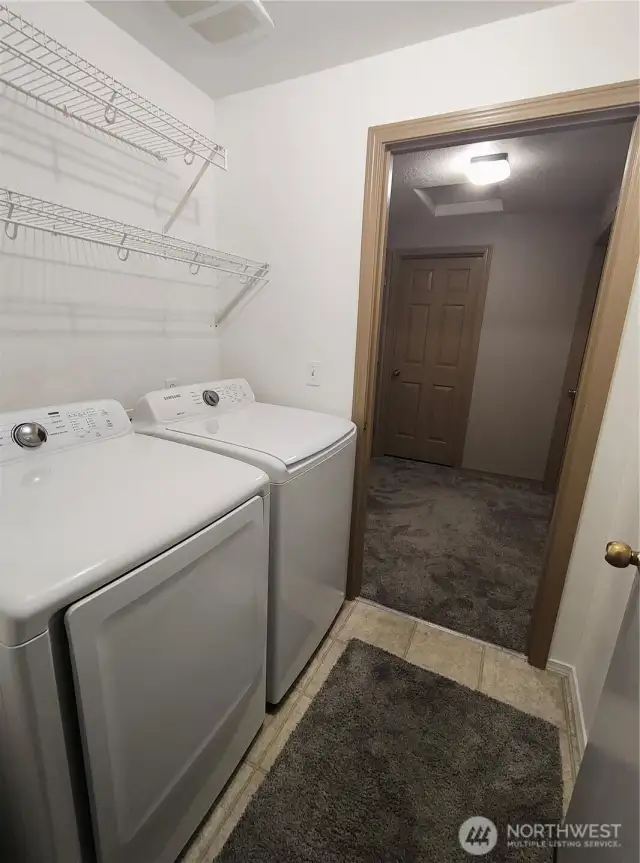 laundry room with Samsung washer & dryer