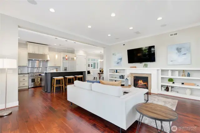 Another shot of the family room featuring the cozy gas fireplace and custom built-ins