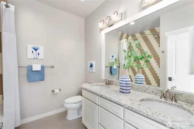 Upstairs full bath with double sinks.