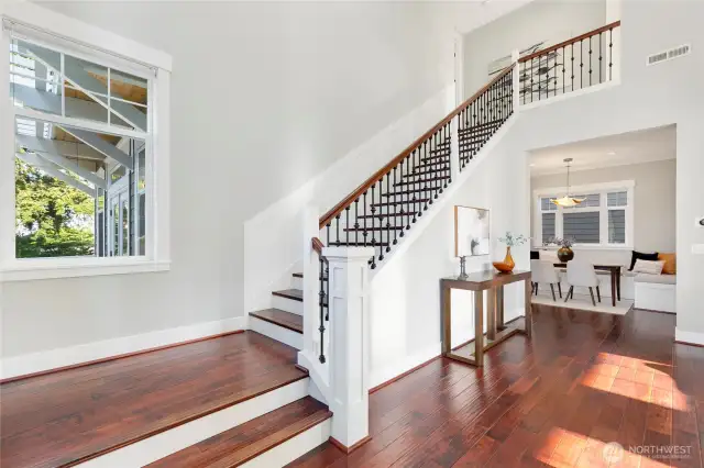 Upon entering this gorgeous home, you are greeted with dramatic vaulted ceilings and a beautiful staircase.