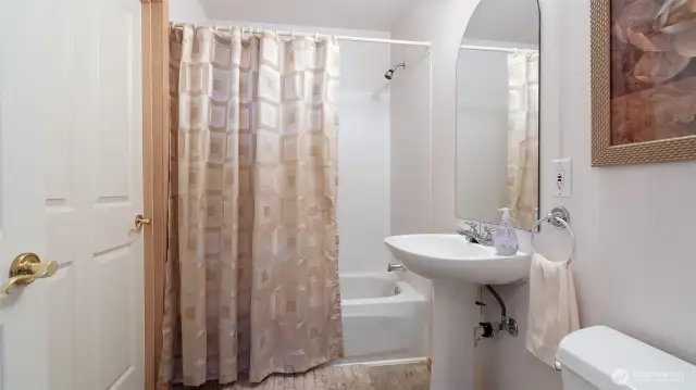 Full bath is ensuite to bedroom #2 and also accessed by the hallway