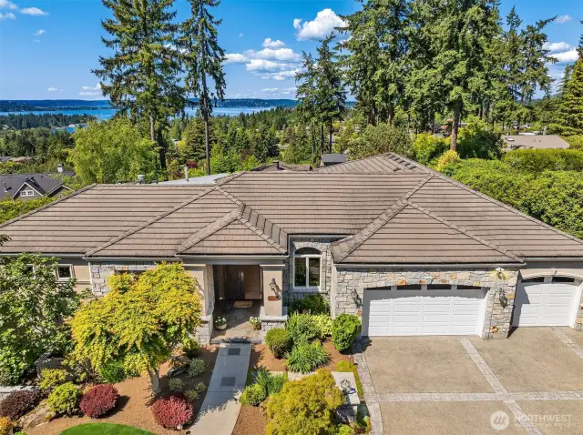 Experience breathtaking sunsets and sweeping west and north vistas from this stunning Clyde Hill luxury home.