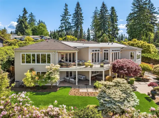 Enjoy two levels of outdoor entertaining spaces overlooking mature landscaping, a charming fountain, and a perfectly sized backyard.