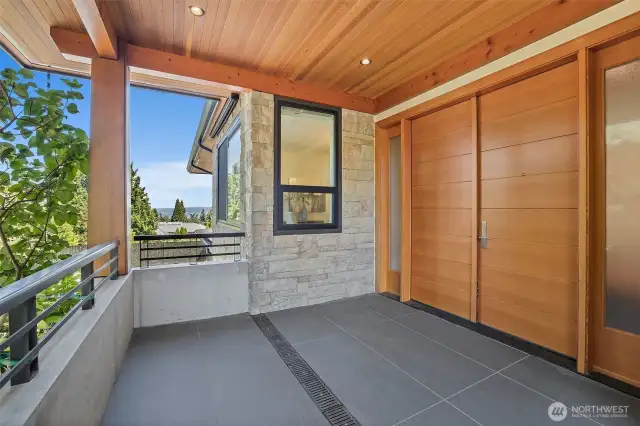 Main entry 8' tall double VG Fir Door unit. Clear Cedar deck and entry column capping