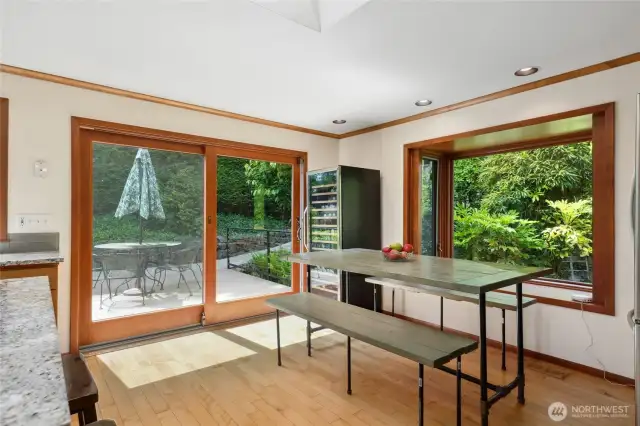 Breakfast area has a bay window seat and slider to the side deck.