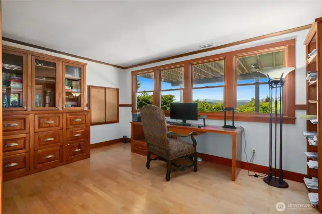 the den/office has built-ins and large view windows.