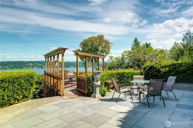Off the italian patio is a view deck with arbors.